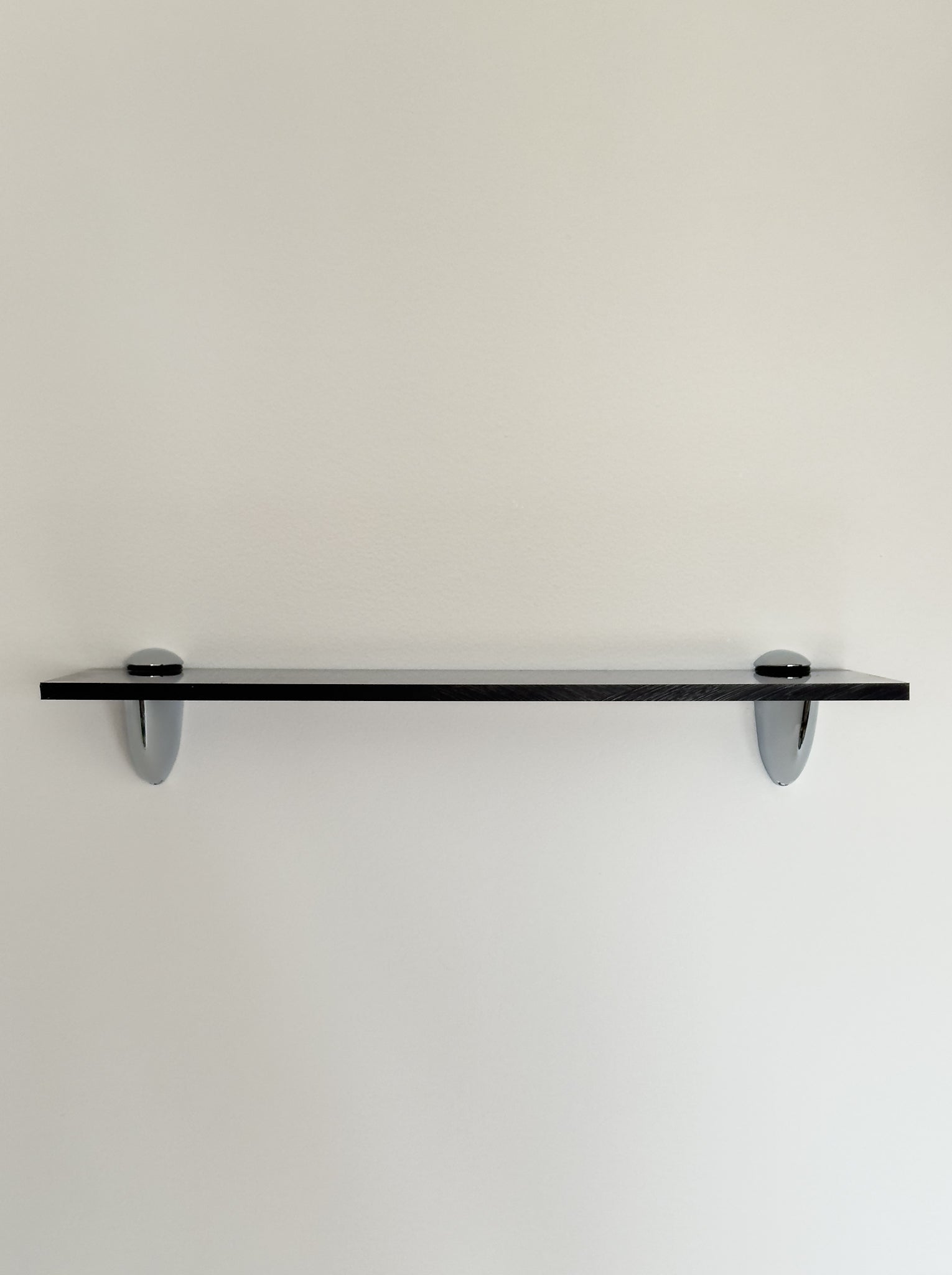 Wall shelf in Acrylic glass and chrome, tinted in smoky brown color shade, from French design studio 70space, inspired by the 70s interior design, gives a retro vintage and minimalist modern charm, solid materials in plexiglass / PMMA