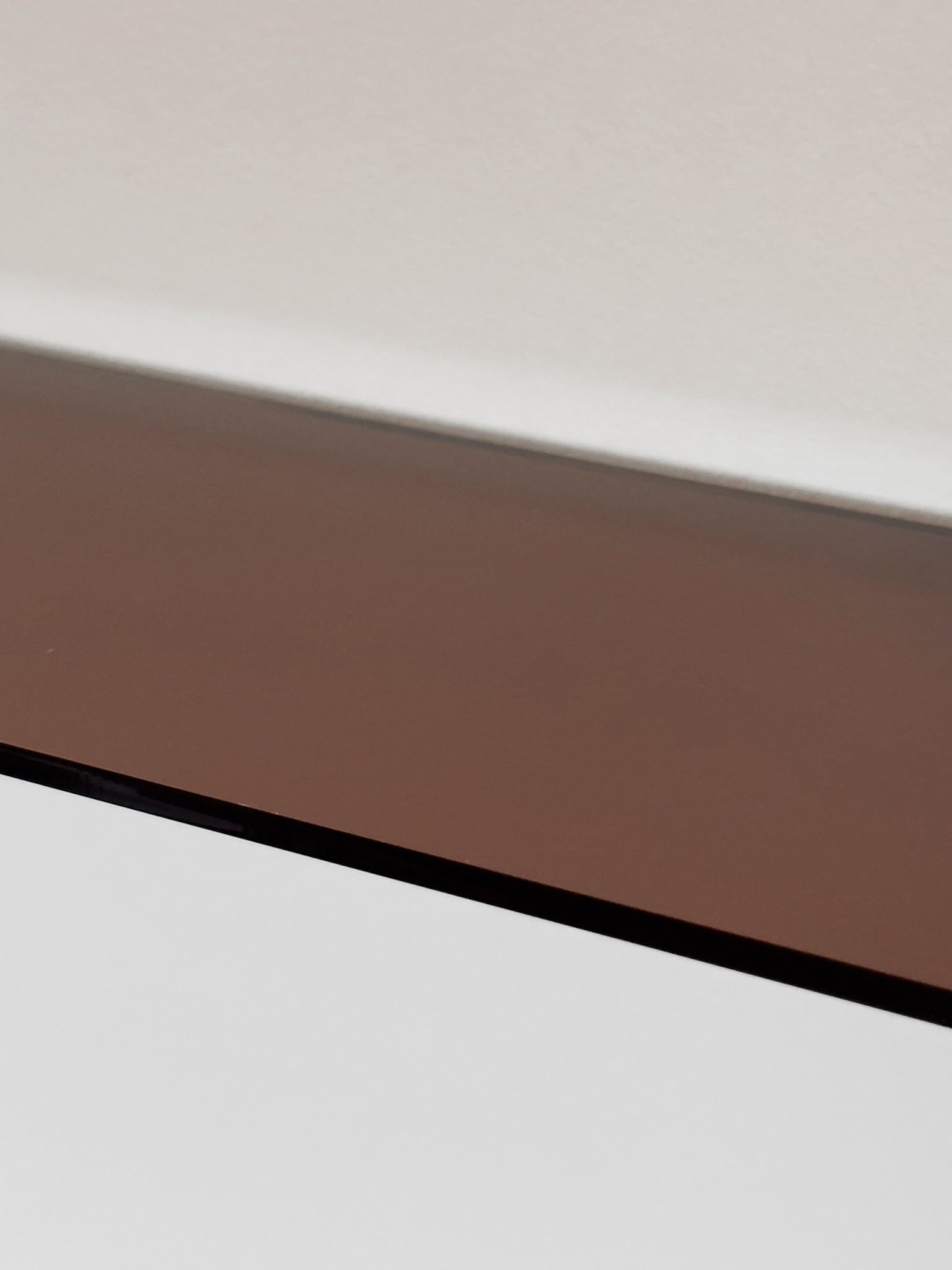 Wall shelf in Acrylic glass and chrome, tinted in smoky brown color shade, from French design studio 70space, inspired by the 70s interior design, gives a retro vintage and minimalist modern charm, solid materials in plexiglass / PMMA