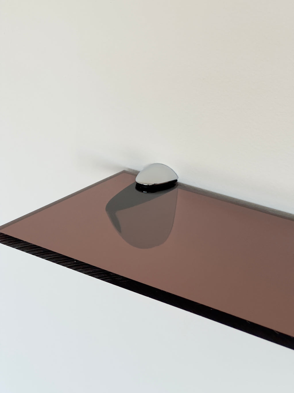 Wall shelf in Acrylic glass and chrome, tinted in smoky brown color shade, from French design studio 70space, inspired by the 70s interior design, gives a retro charm, solid materials in plexiglass / PMMA